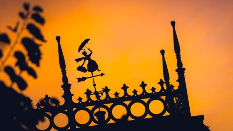 Orange Sunset Behind Fence with Mary Poppins Detailing