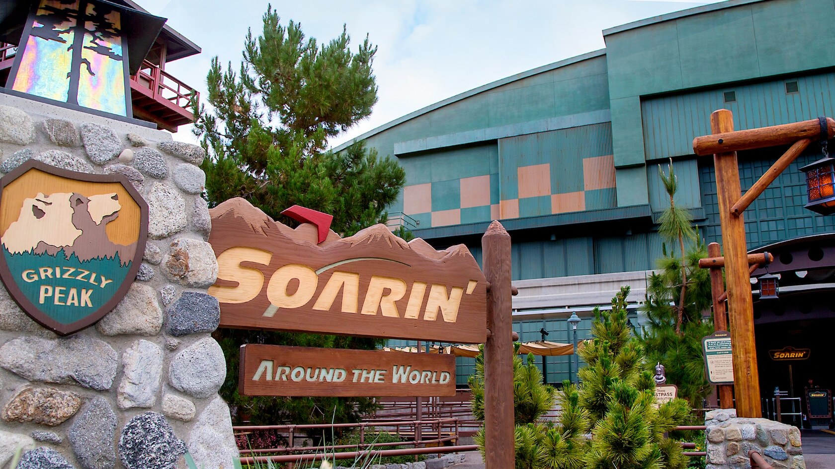 Soarin' signage with rock and wood