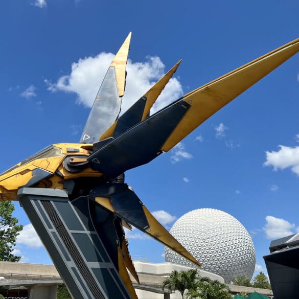 Another Guest Takes a Fall Exiting the Guardians of the Galaxy Ride 30 Yellow spaceship in front of EPCOT ball