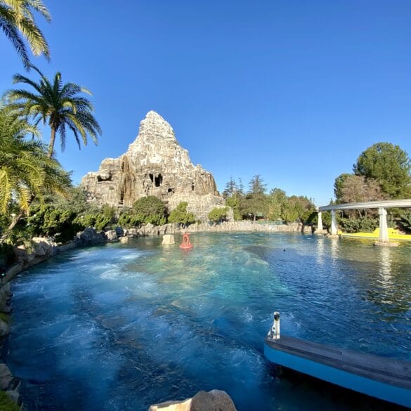 Finding Nemo Submarine Voyage Will Reopen July 25th at Disneyland 1 Lagoon with yellow submarine and mountain