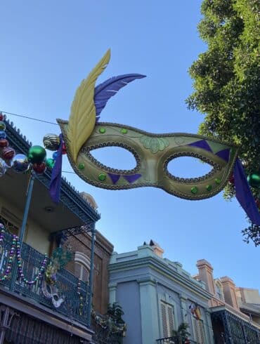 A Guide To New Orleans Square at Disneyland Park 70 Mask decoration above buildings
