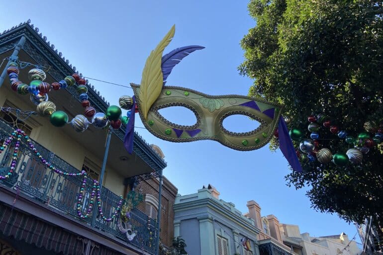 A Guide To New Orleans Square at Disneyland Park 107 Mask decoration above buildings