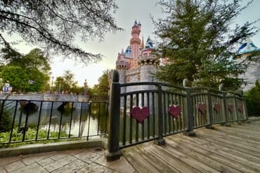 8 Ways to Celebrate Mother's Day at Disneyland Resort 55 Castle with bridge and snow on top