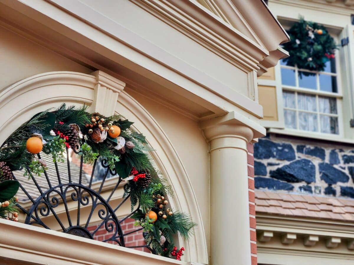 2026 EPCOT Candlelight Processional: The Stunning Show You Can't Miss 27 Decor hanging on building