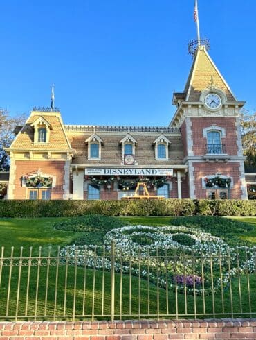 How Many Days Should you Spend at Disneyland? 17 Mickey in flowers at railroad station