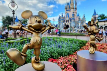 Where to Play, Eat & Shop on Main Street, U.S.A. – Disney World Guide 86 50th anniversary statues of Mickey and Minnie in front of Cinderella Castle at Magic Kingdom Park