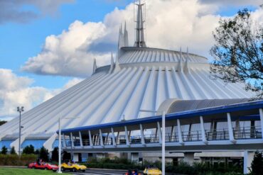 21 Must-Do Disney World Rides at Magic Kingdom 1 Tomorrowland Speedway in front of Space Mountain in Magic Kingdom Park
