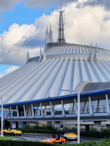 21 Must-Do Disney World Rides at Magic Kingdom 256 Tomorrowland Speedway in front of Space Mountain in Magic Kingdom Park